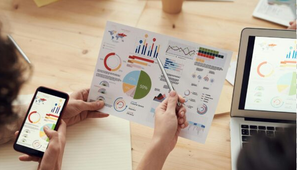 Team reviewing digital marketing analytics and performance reports for better strategy and ROI.